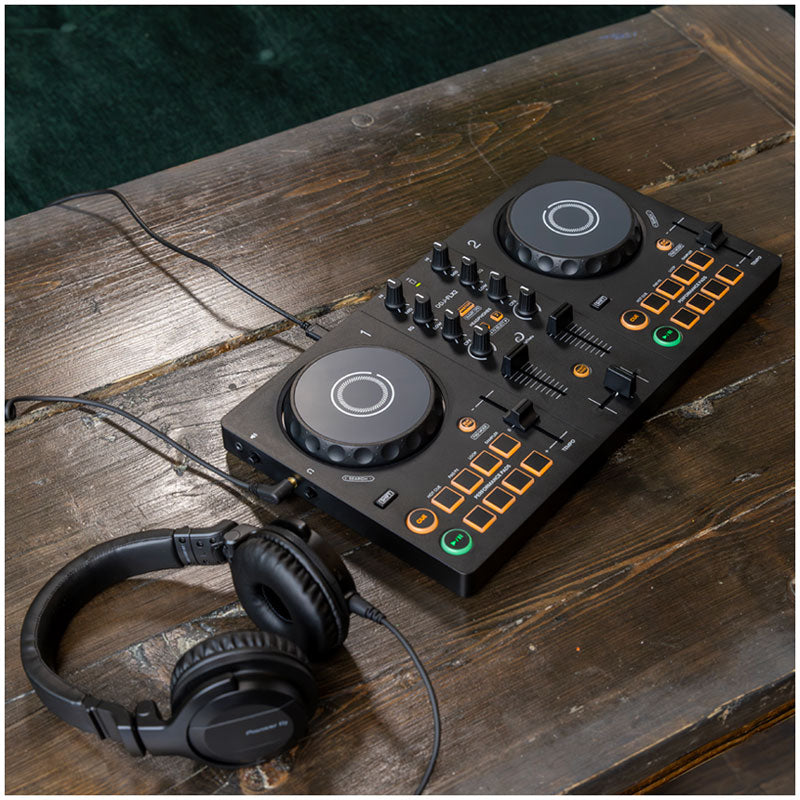 AlphaTheta DDJ-FLX2 2-Channel Rekordbox DJ Controller with hdj-cue1 dj headphones. lifestyle image