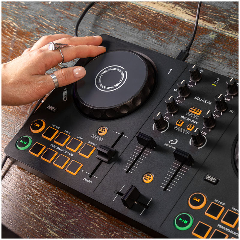 AlphaTheta DDJ-FLX2 2-Channel Rekordbox DJ Controller left jog wheel - lifestyle image